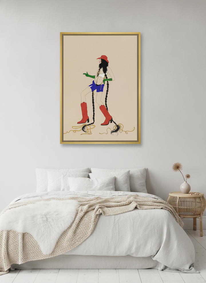 Canvas wall art with a gold leaf surround styled on the wall in a bright Scandinavian bedroom