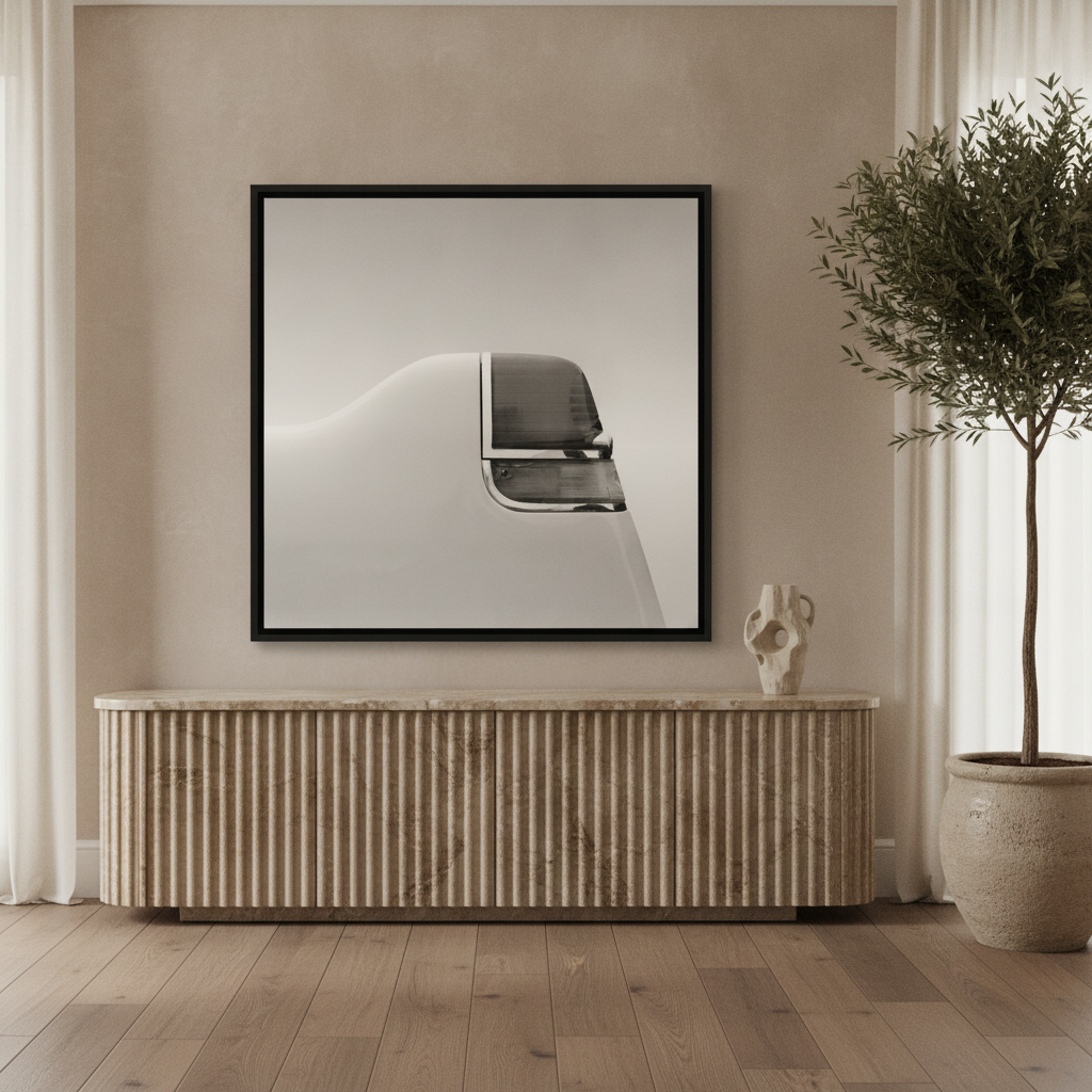 Canvas wall art with a black surround standing on a sideboard in a luxe dining room
