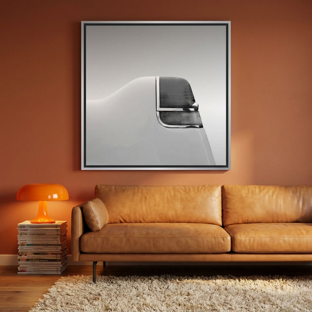 Canvas wall art with a silver leaf surround styled on the wall in a retro 70s living room
