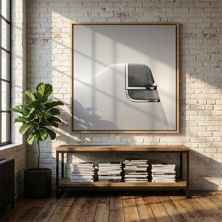 Oversized statement canvas wall art with a natural timber surround styled on the wall in an industrial loft living room