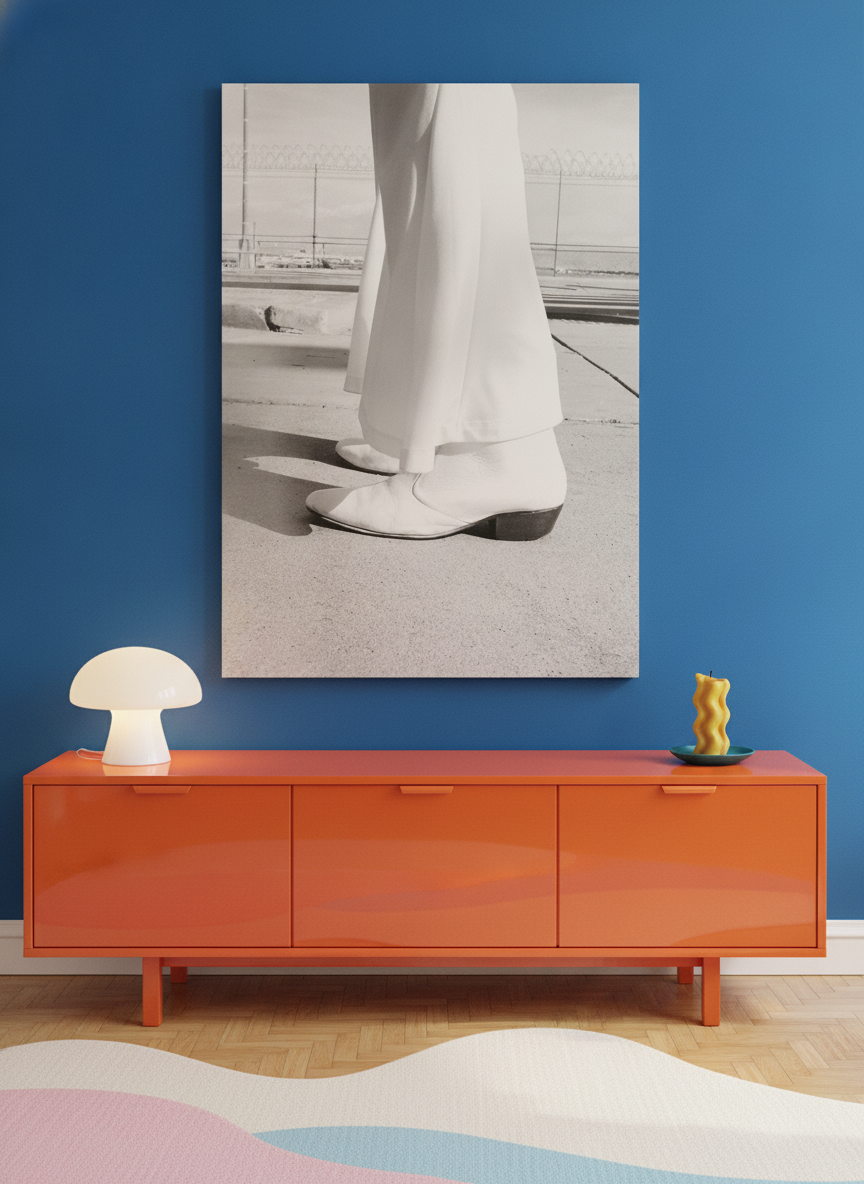 Stretched canvas wall art standing on a sideboard in a colourful eclectic living room