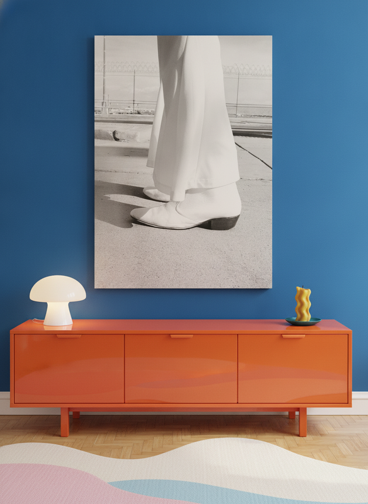 Stretched canvas wall art standing on a sideboard in a colourful eclectic living room