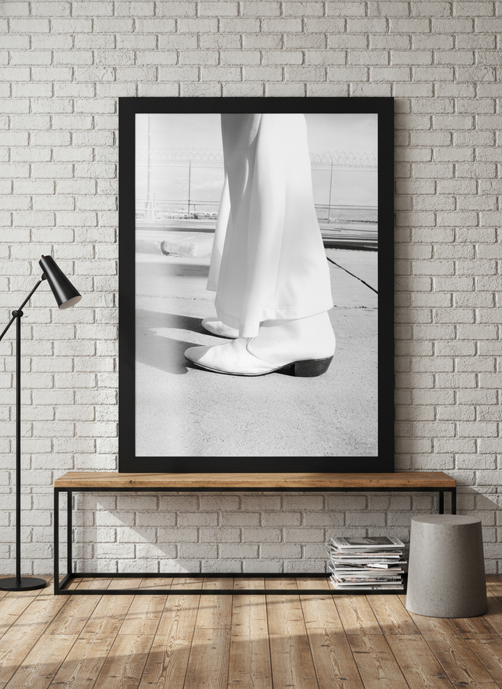 Modern wall art print standing on a console in an industrial loft home office