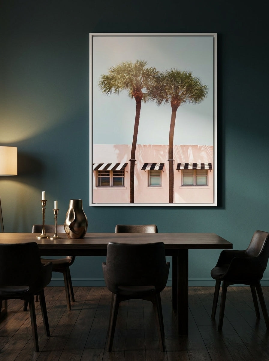 Oversized statement canvas wall art with a white surround styled on the wall in a moody dining room