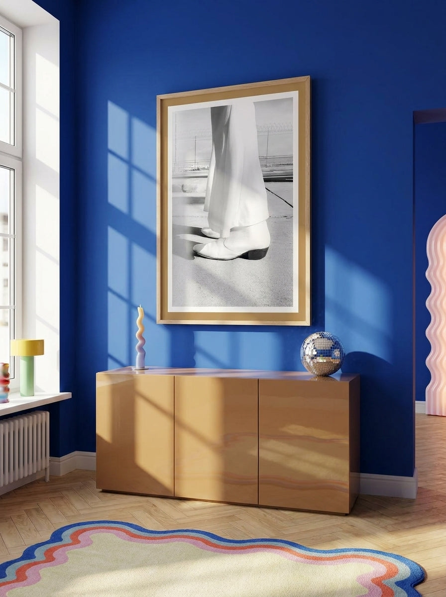 Modern wall art print styled on the wall in a colourful eclectic living room