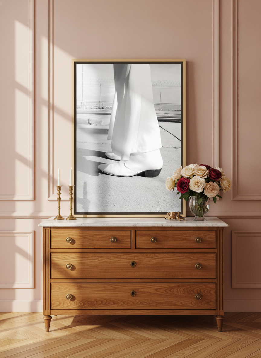 Canvas wall art with a natural timber surround standing on a sideboard in a Parisian bedroom
