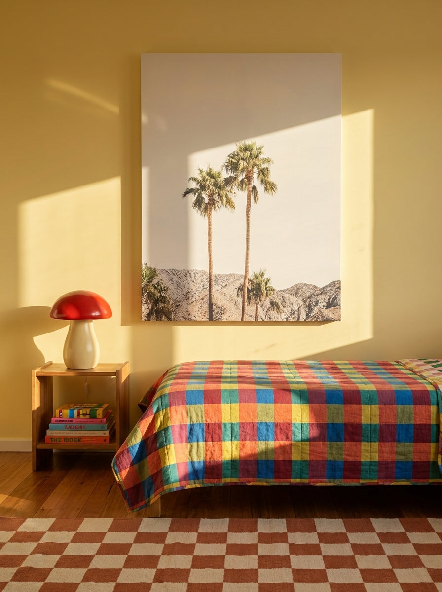 Stretched canvas wall art styled on the wall in a colourful eclectic bedroom