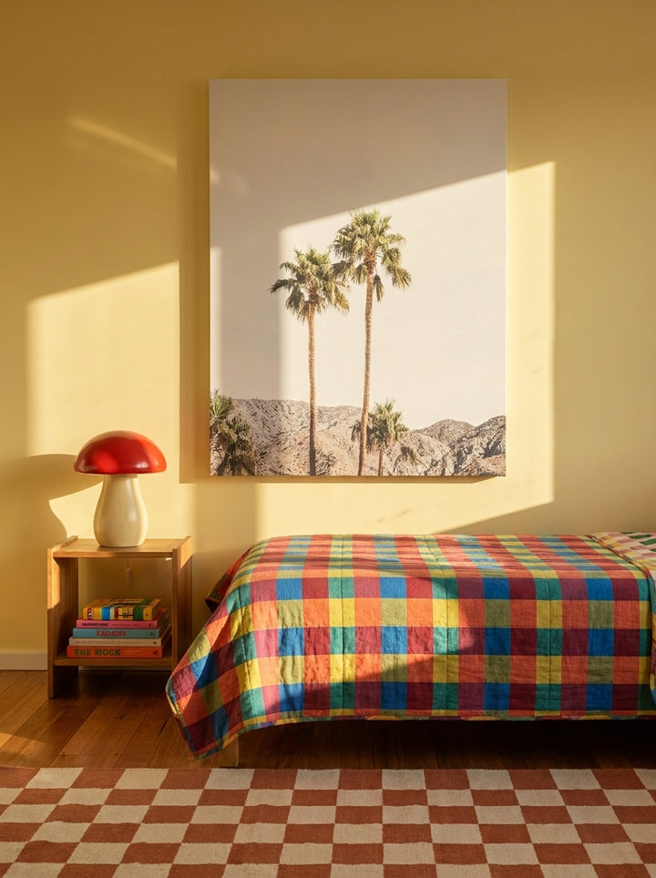 Stretched canvas wall art styled on the wall in a colourful eclectic bedroom