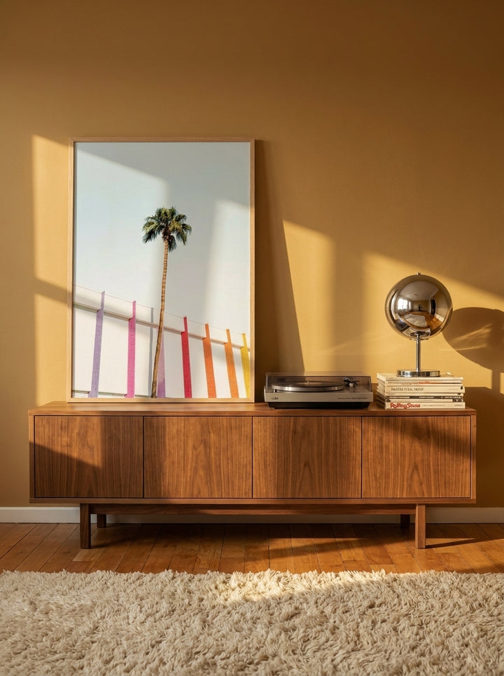 Modern wall art print standing on a sideboard in a retro 70s home office