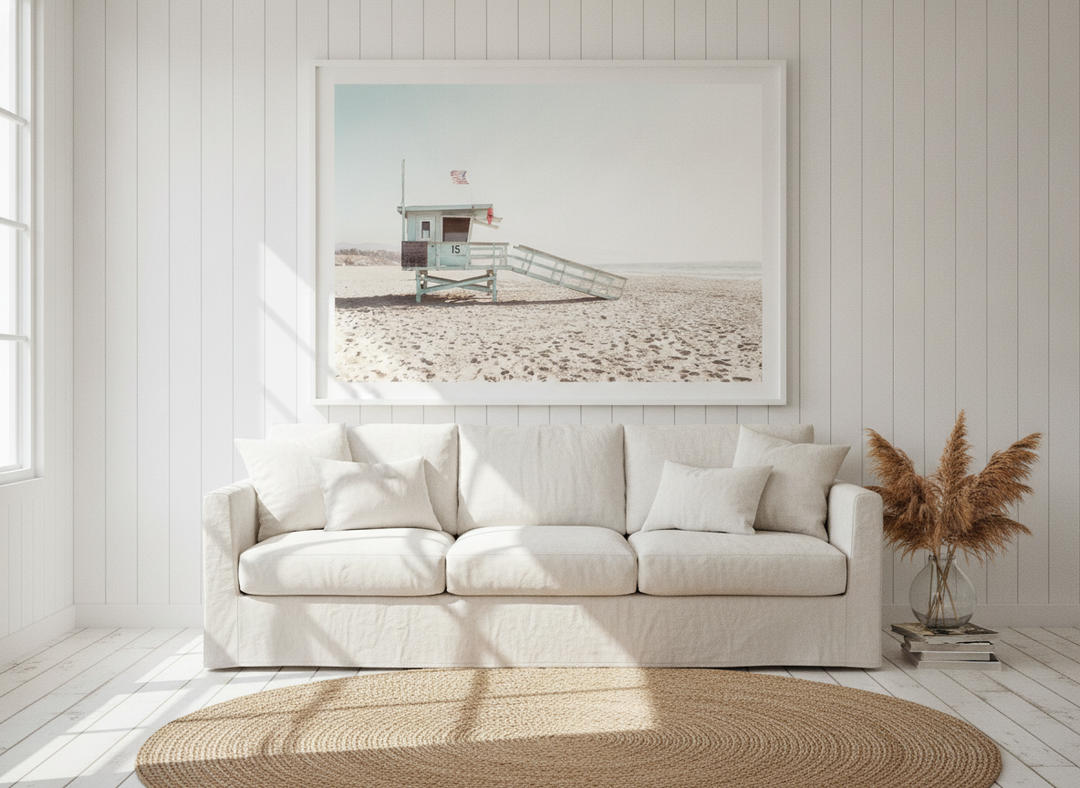 Oversized statement modern wall art print styled on the wall in a coastal living room