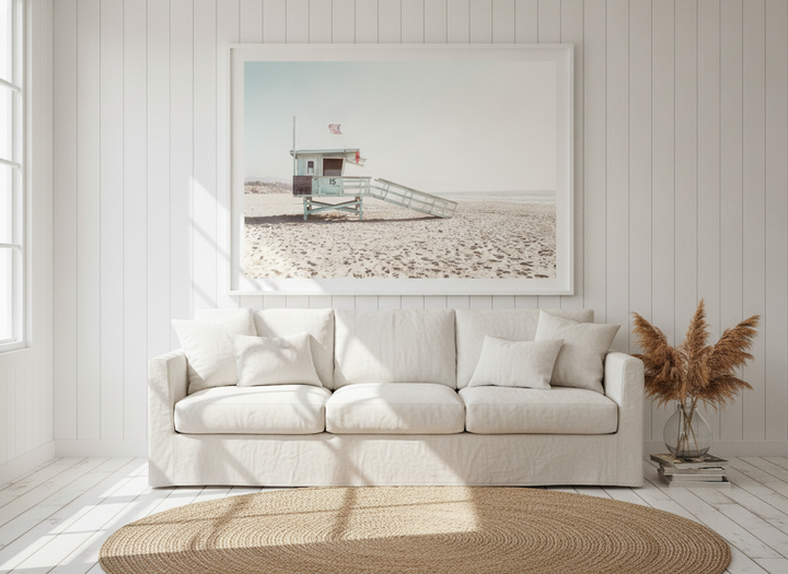 Oversized statement modern wall art print styled on the wall in a coastal living room