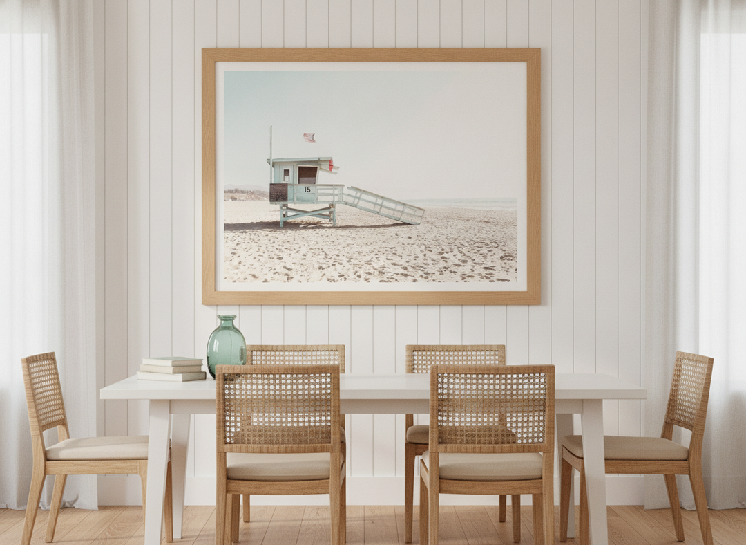 Modern wall art print styled on the wall in a coastal dining room