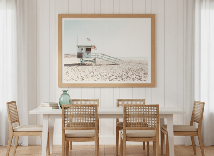 Modern wall art print styled on the wall in a coastal dining room