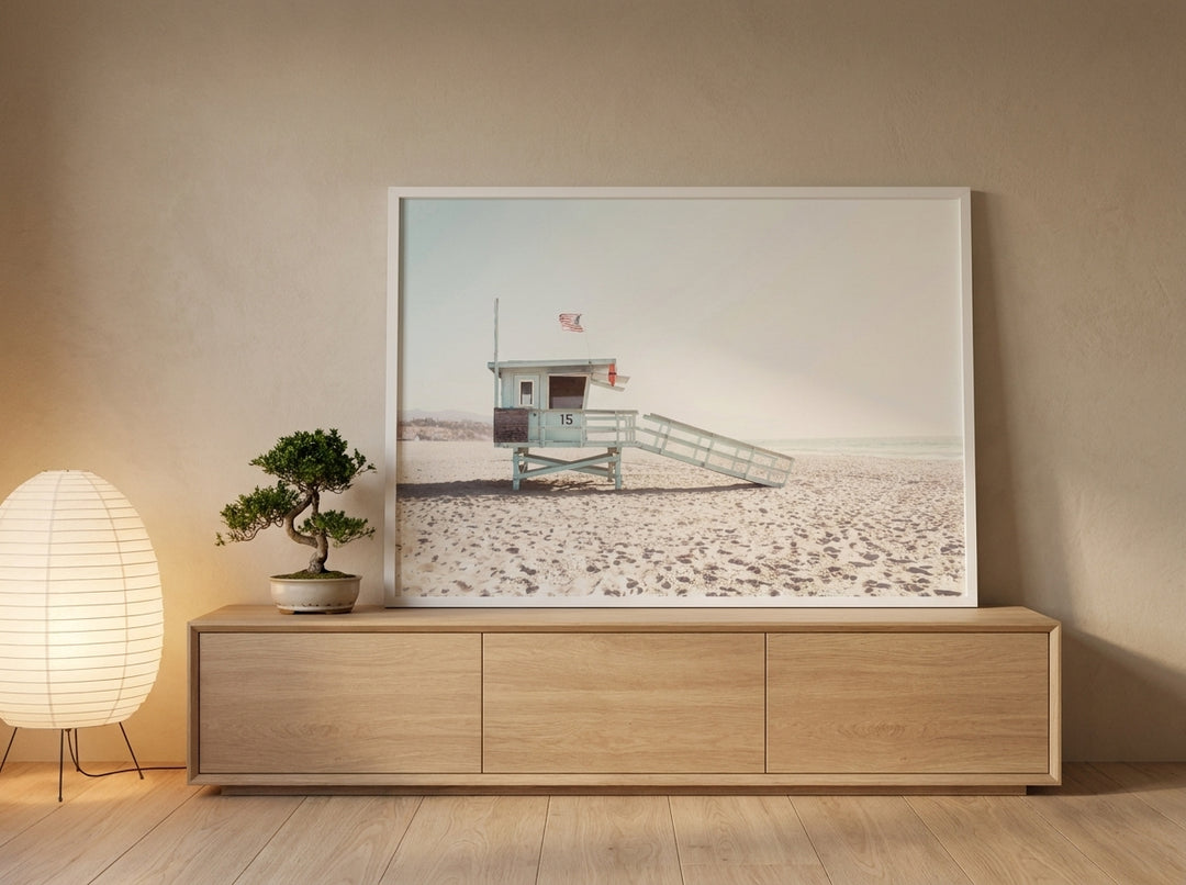 Modern wall art print standing on a sideboard in a warm Japandi bedroom