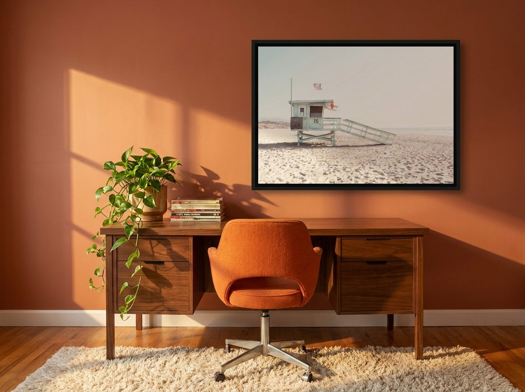 Canvas wall art with a black surround styled on the wall in a retro 70s home office