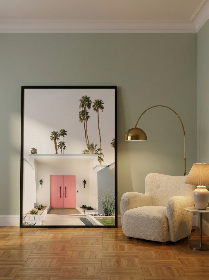 Oversized statement modern wall art print leaning against the wall in a mid-century bedroom