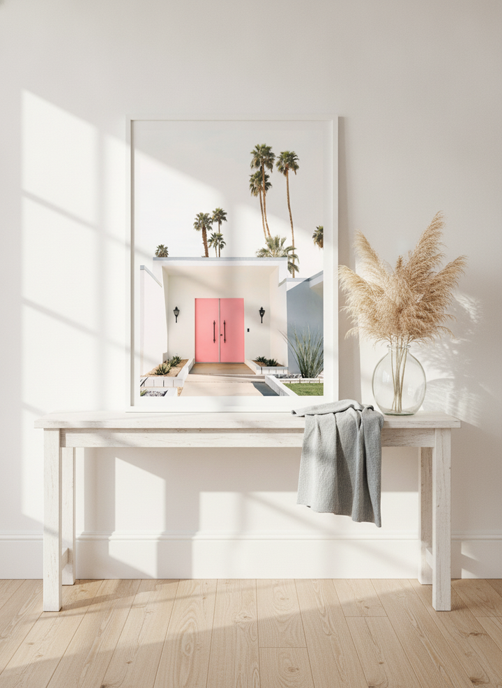 Modern wall art print standing on a console in a coastal home office