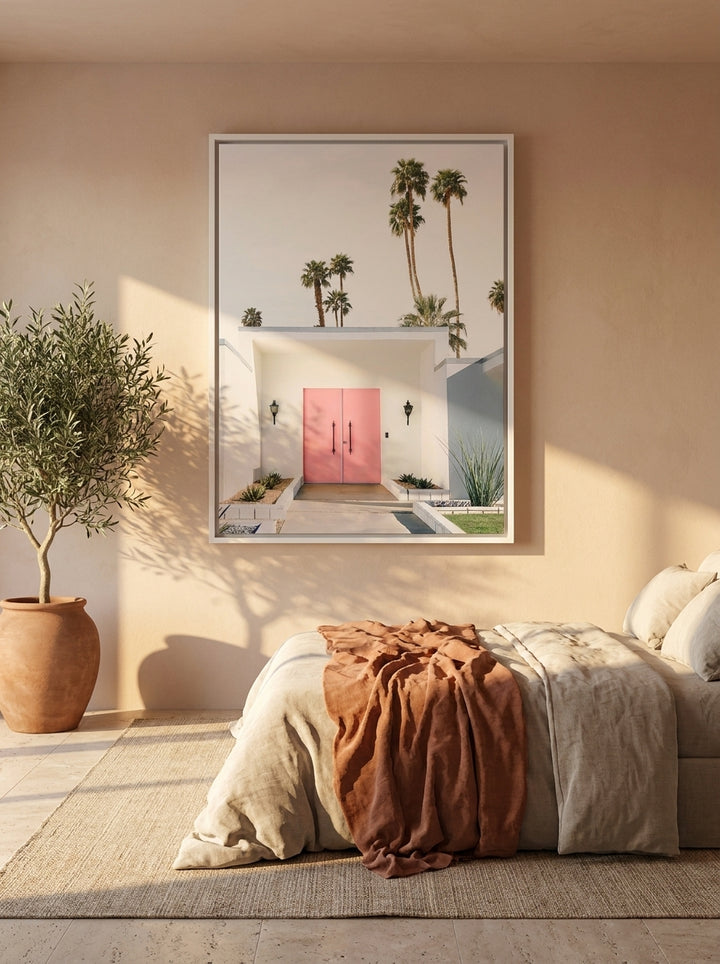 Canvas wall art with a white surround styled on the wall in a Mediterranean bedroom