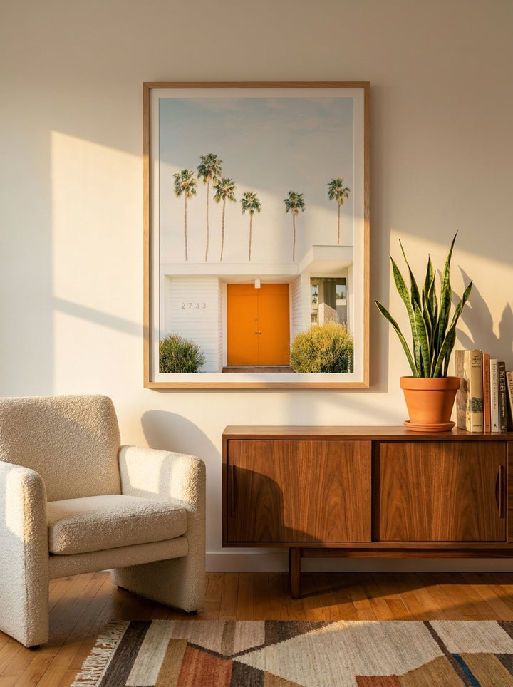 Modern wall art print styled on the wall in a mid-century living room