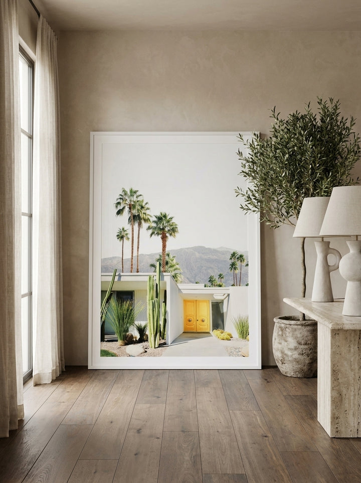 Oversized statement modern wall art print leaning against the wall in a luxe dining room