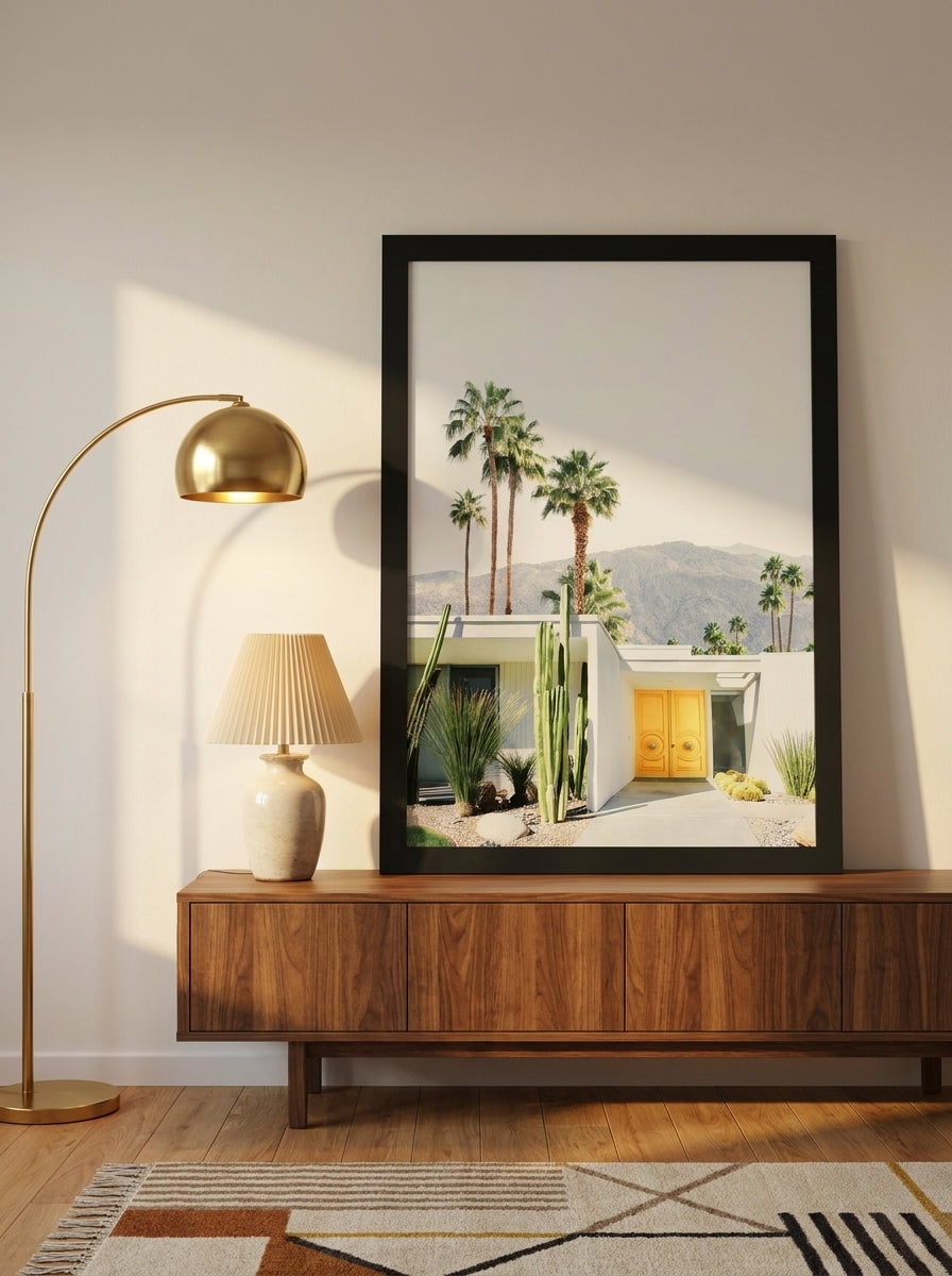 Modern wall art print standing on a sideboard in a mid-century home office