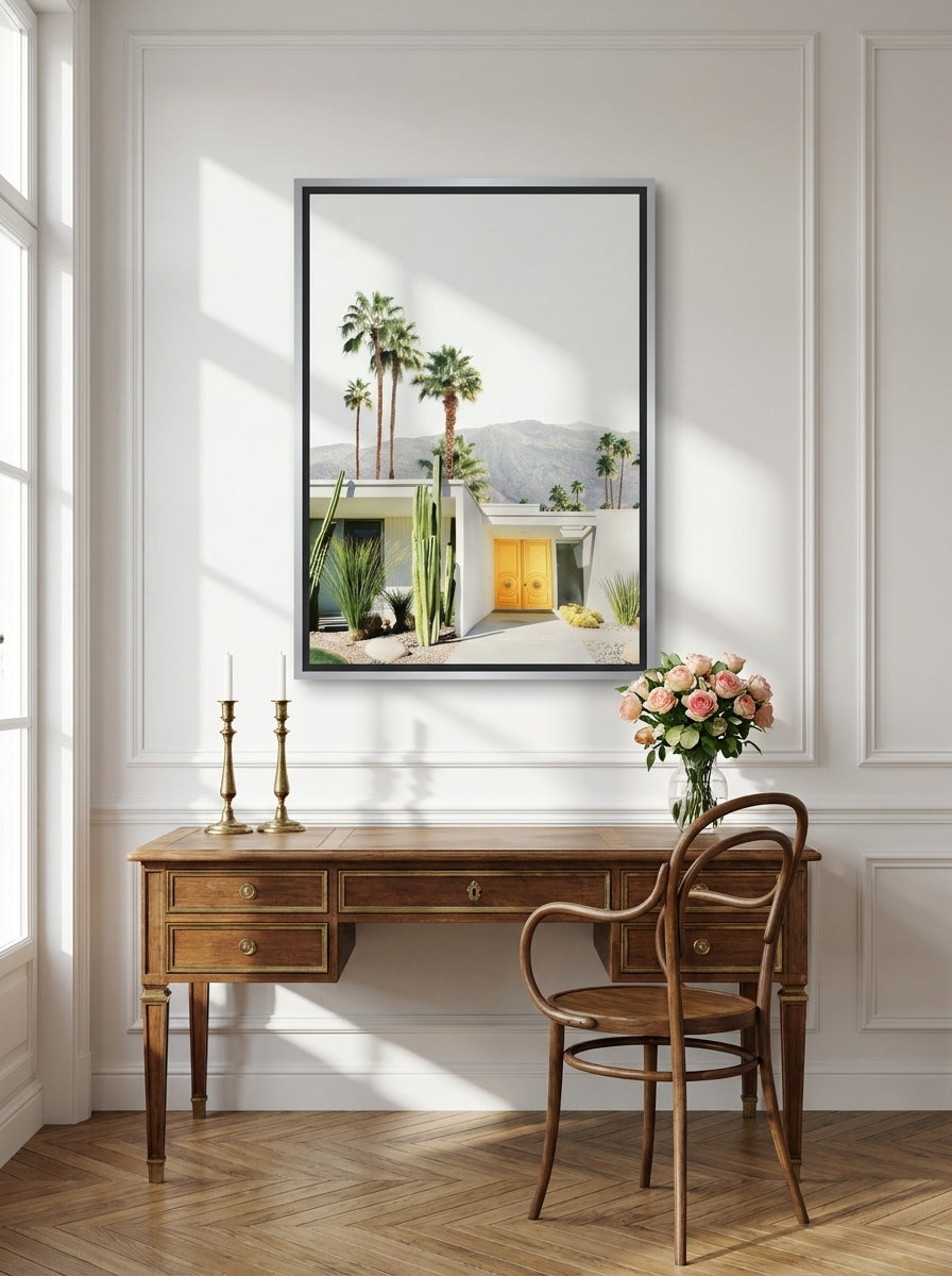 Canvas wall art with a silver leaf surround styled on the wall in a Parisian home office
