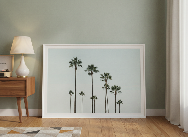 Modern wall art print leaning against the wall in a mid-century living room