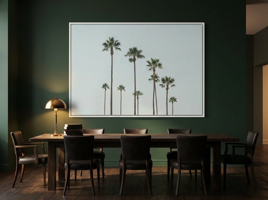 Oversized statement canvas wall art with a white surround styled on the wall in a moody dining room