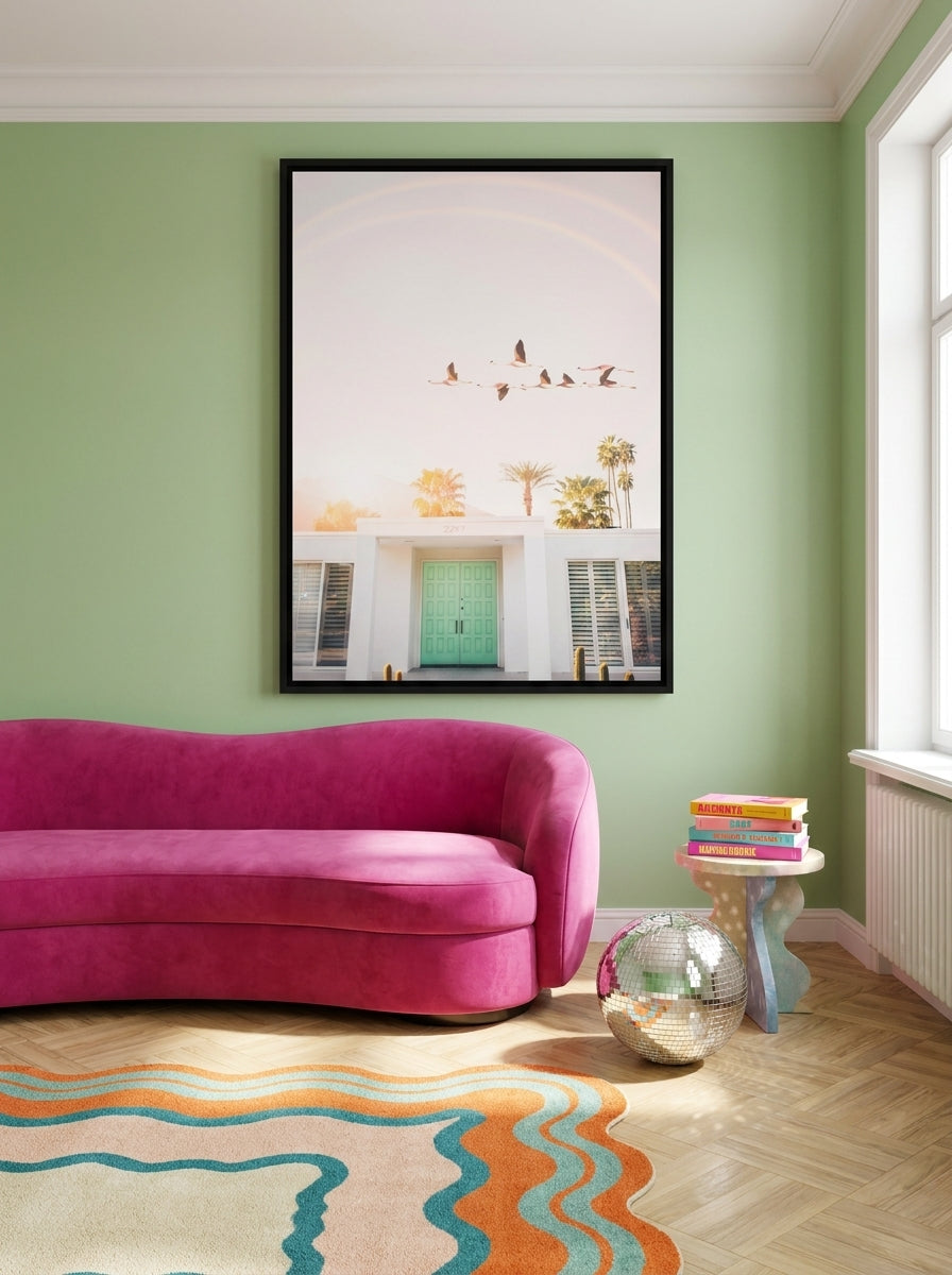 Oversized statement canvas wall art with a black surround styled on the wall in a colourful eclectic living room