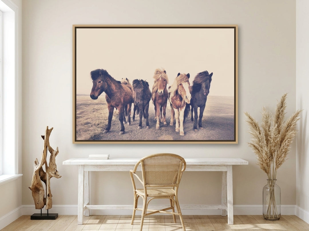 Oversized statement canvas wall art with a natural timber surround styled on the wall in a coastal home office