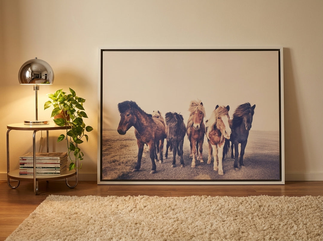 Oversized statement canvas wall art with a white surround leaning against the wall in a retro 70s living room