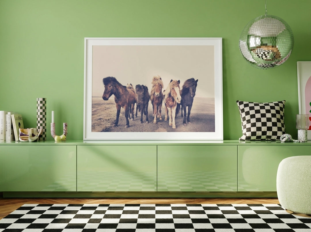 Modern wall art print standing on a sideboard in a colourful eclectic bedroom