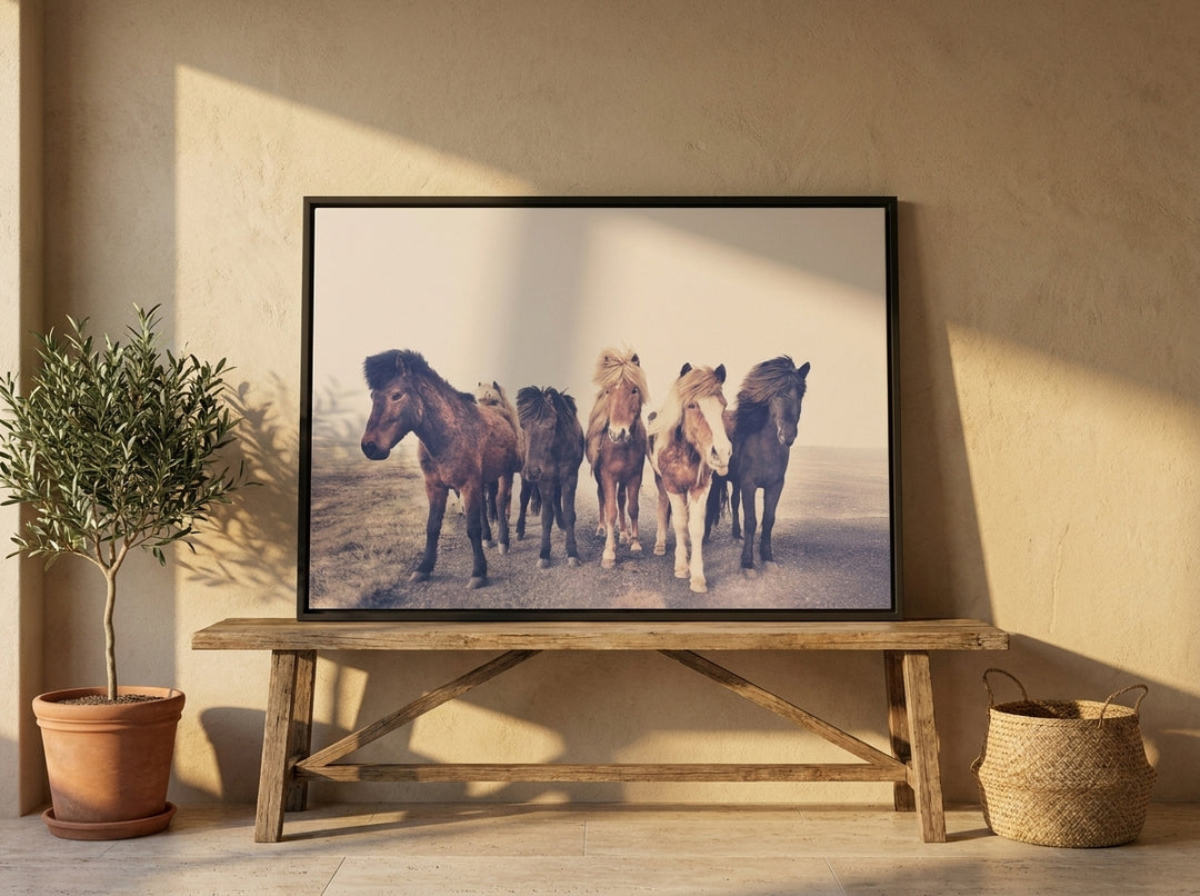 Canvas wall art with a black surround standing on a bench in a Mediterranean bedroom