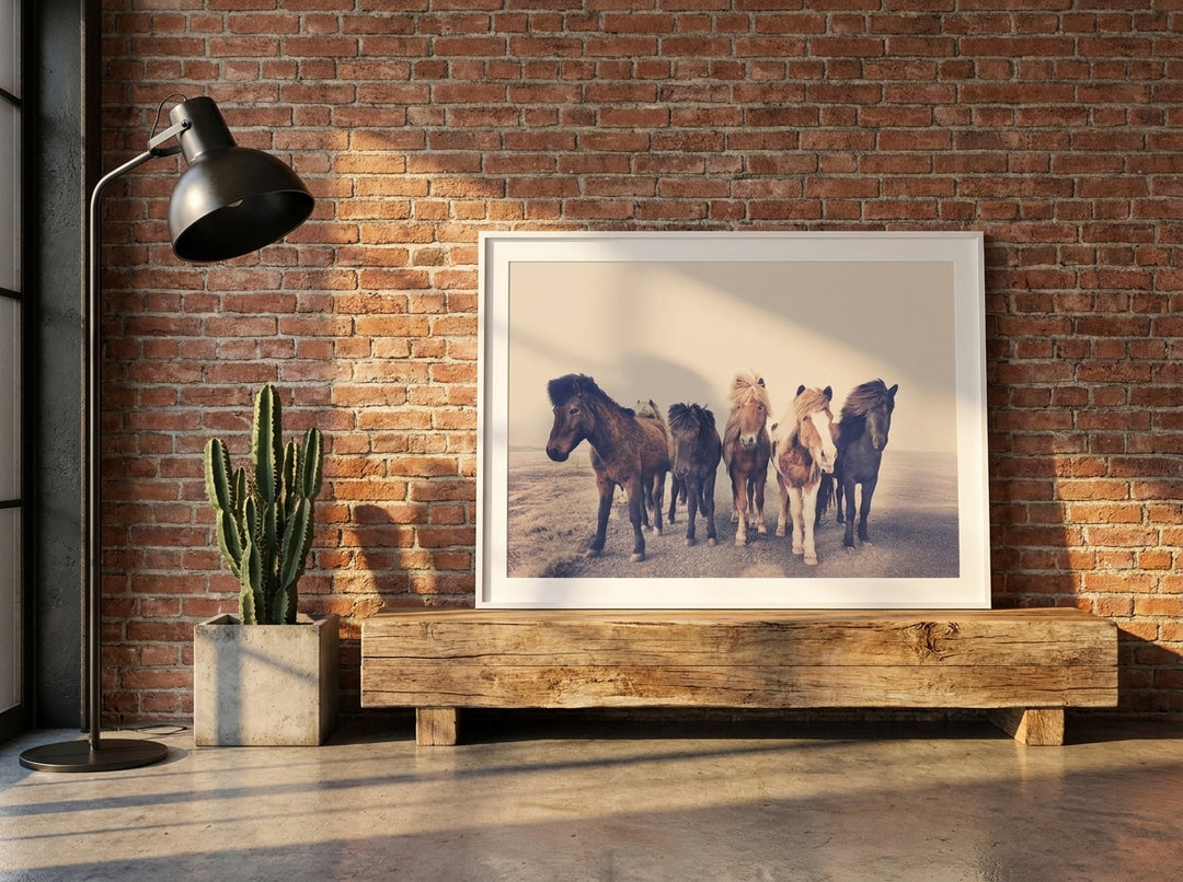 Modern wall art print standing on a bench in an industrial loft bedroom