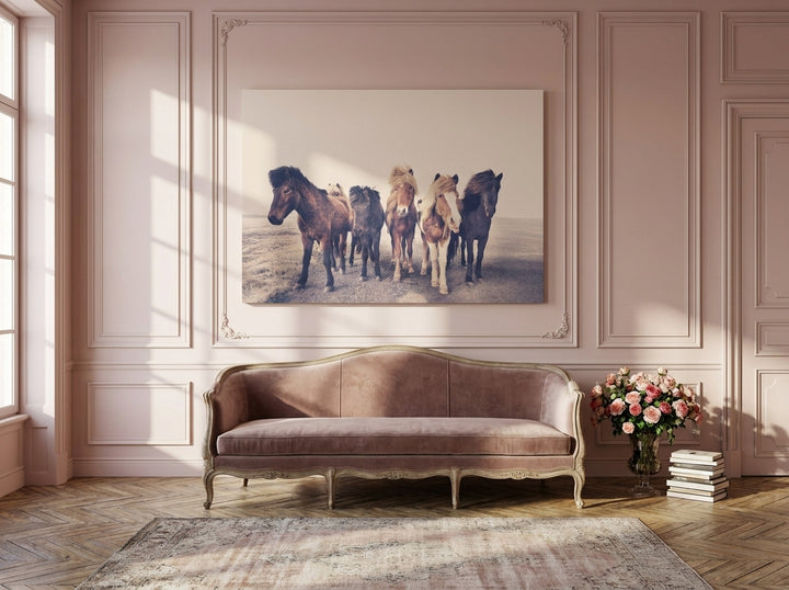 Stretched canvas wall art styled on the wall in a Parisian living room