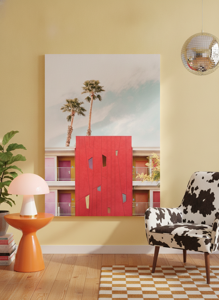 Stretched canvas wall art leaning against the wall in a colourful eclectic living room