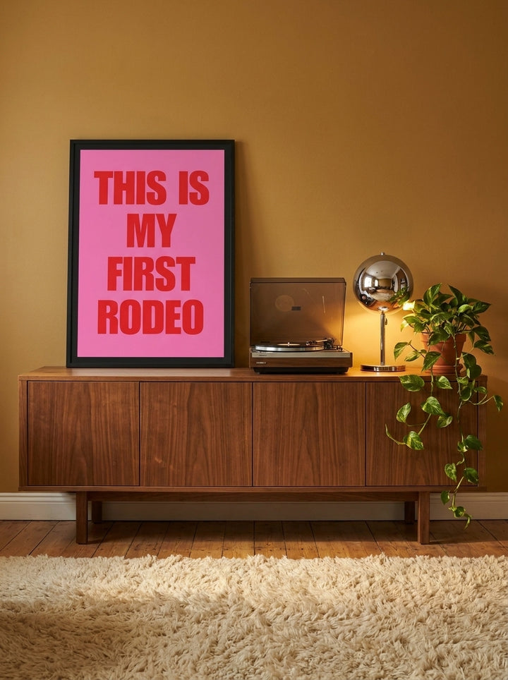 Modern wall art print standing on a sideboard in a retro 70s home office