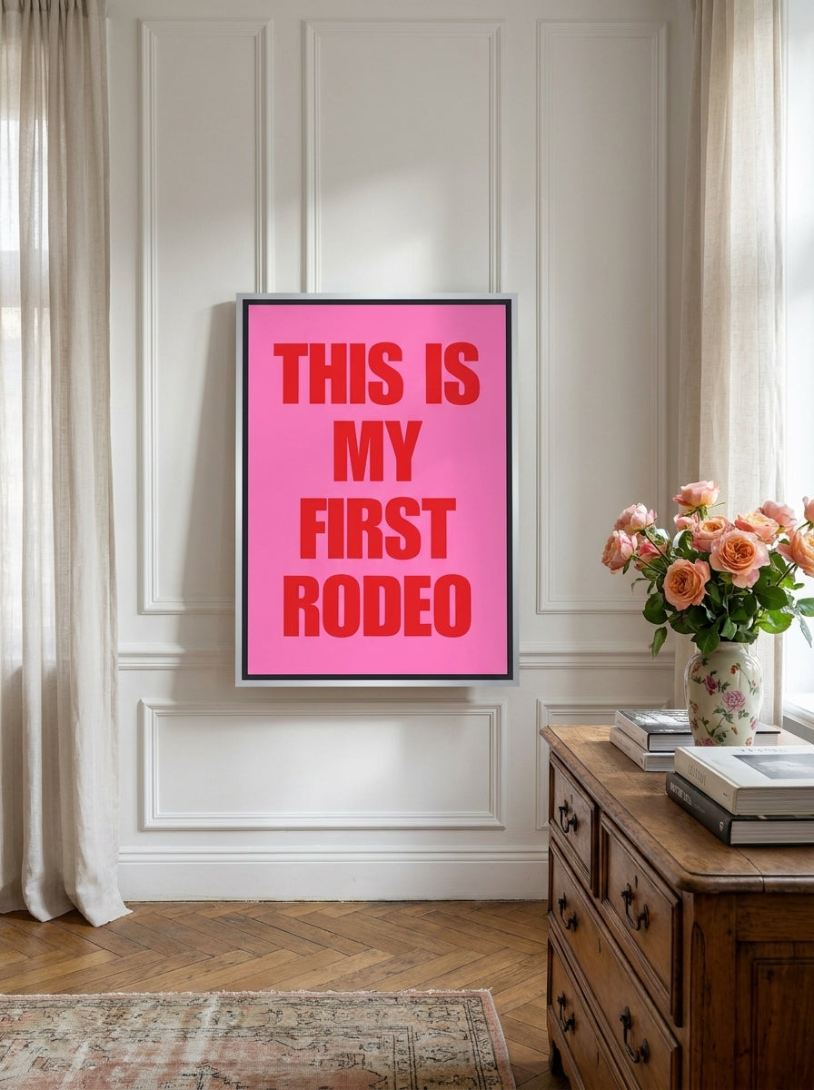 Canvas wall art with a silver leaf surround standing on a sideboard in a Parisian home office