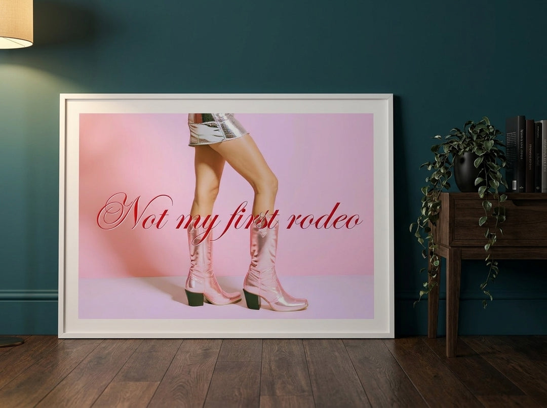 Modern wall art print leaning against the wall in a moody bedroom