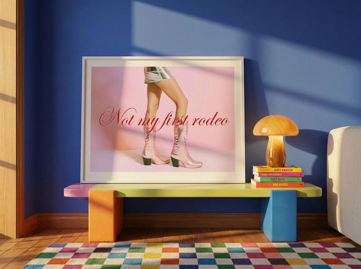 Modern wall art print standing on a side table in a colourful eclectic bedroom