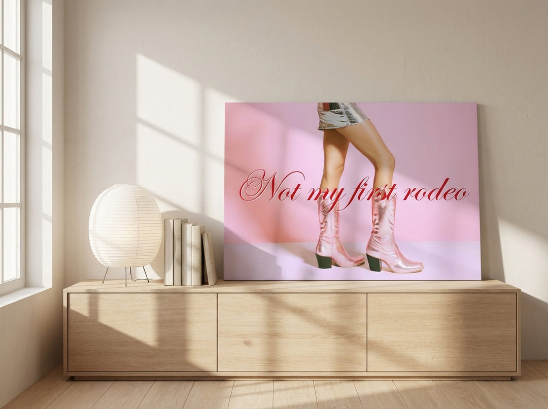 Stretched canvas wall art standing on a sideboard in a warm Japandi living room