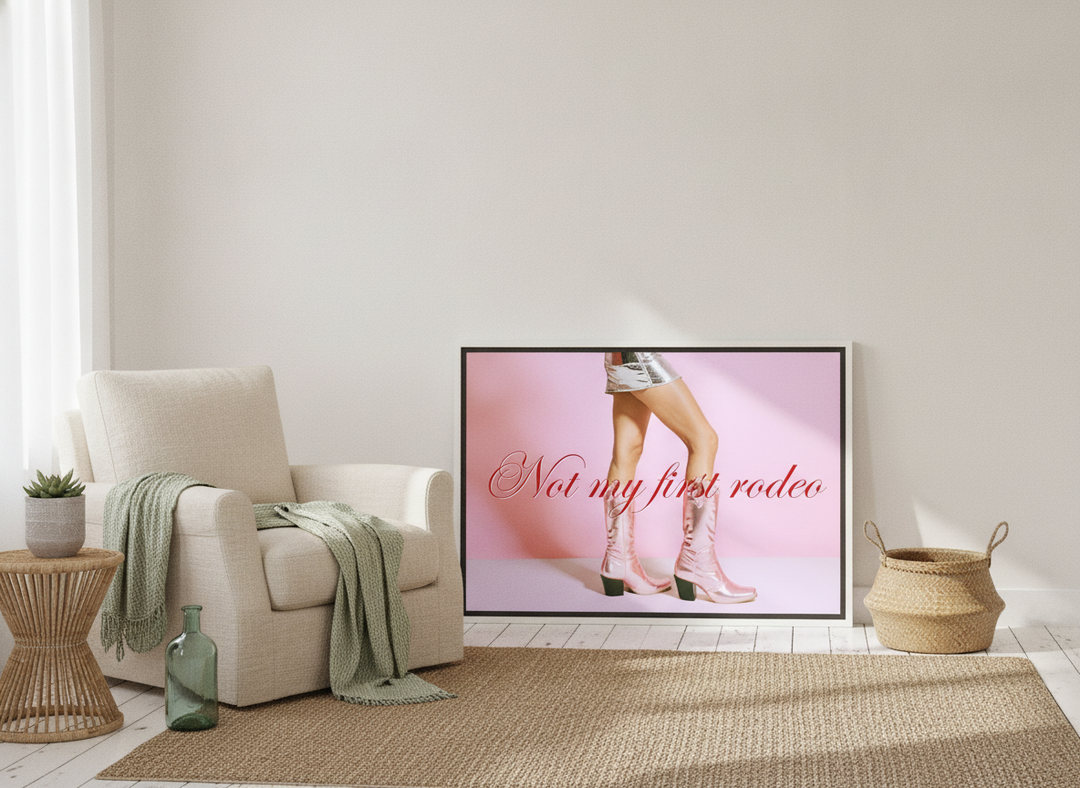 Canvas wall art with a white surround leaning against the wall in a coastal home office