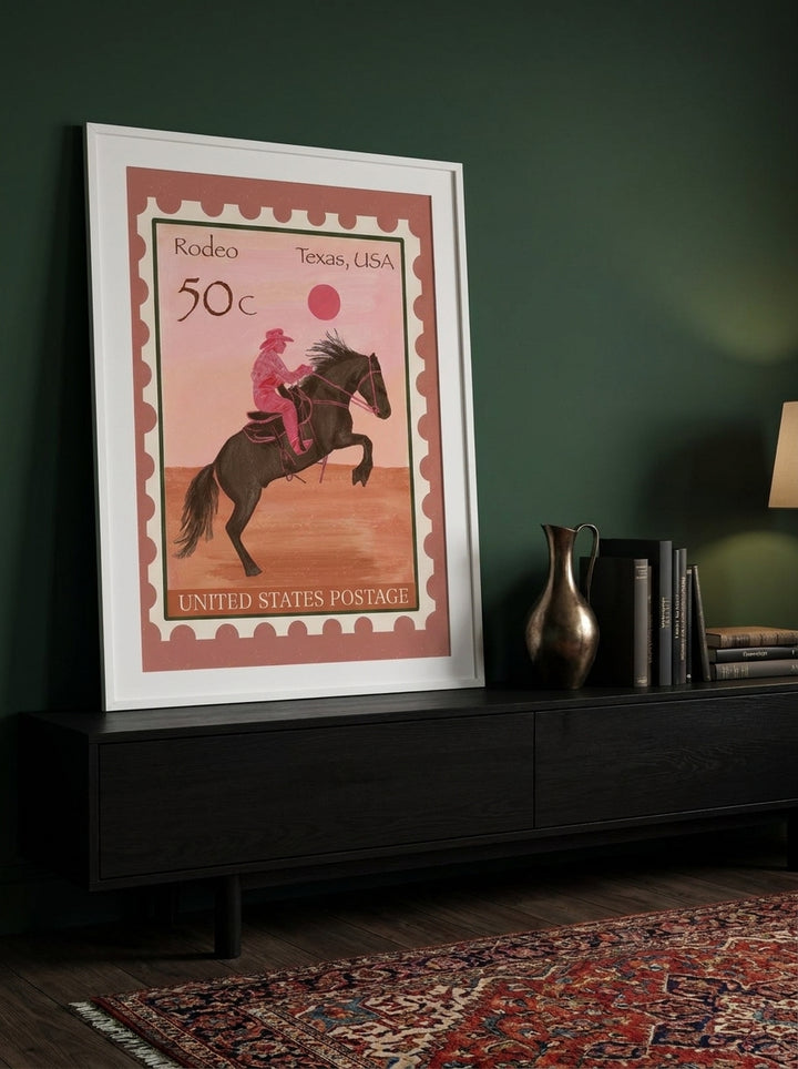 Modern wall art print standing on a console in a moody living room