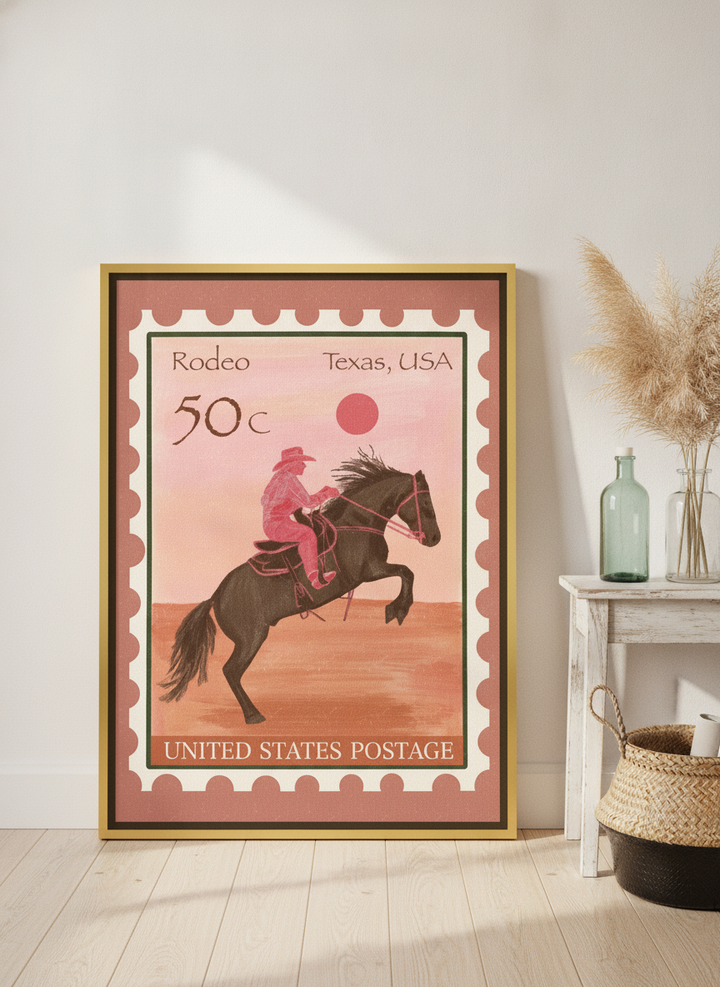 Canvas wall art with a gold leaf surround leaning against the wall in a coastal living room