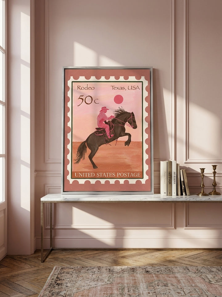 Canvas wall art with a silver leaf surround standing on a console in a Parisian home office