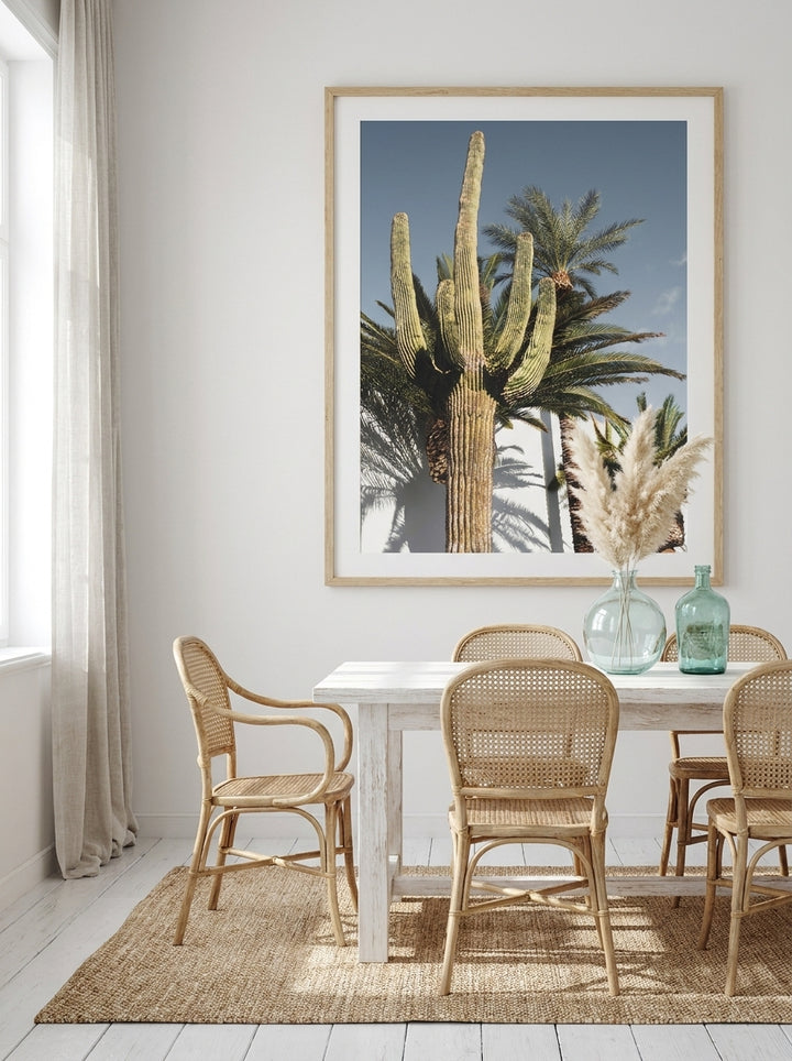 Oversized statement modern wall art print styled on the wall in a coastal dining room