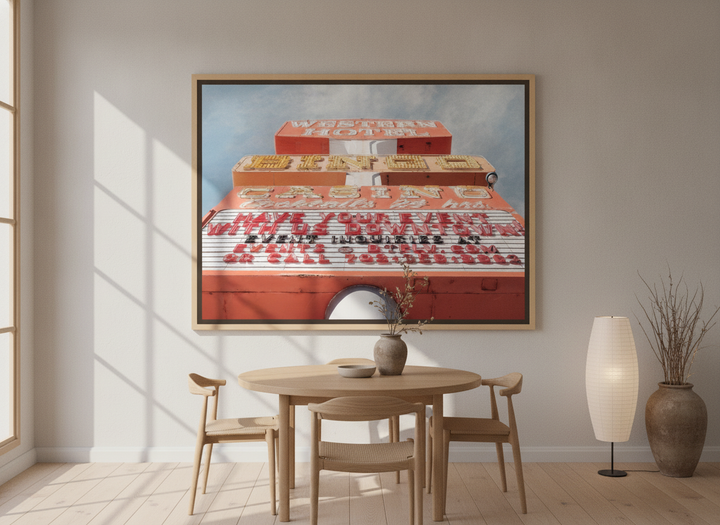 Oversized statement canvas wall art with a natural timber surround styled on the wall in a warm Japandi dining room