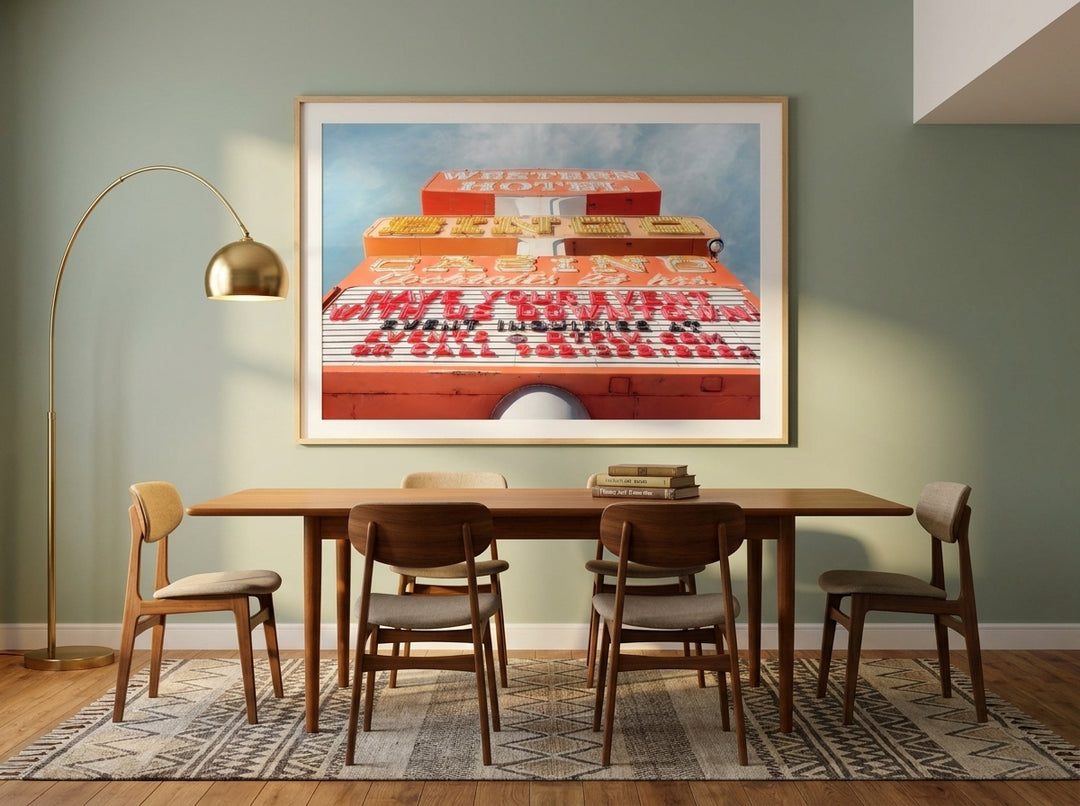 Oversized statement modern wall art print styled on the wall in a mid-century dining room