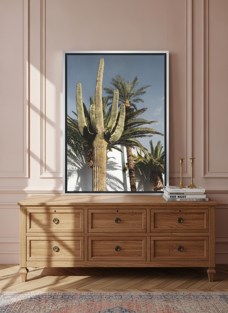 Canvas wall art with a silver leaf surround standing on a sideboard in a Parisian home office