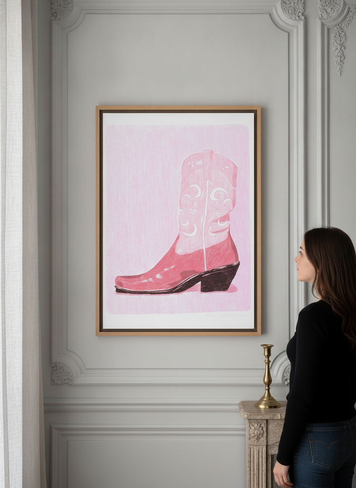 Person holding canvas wall art with a natural timber surround in a Parisian living room